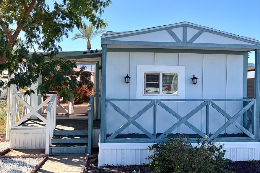 ***SELLER TO CREDIT BUYER AMT EQUAL TO 2 MONTH'S RENT AT CLOSING***Recently updated, this charming porch-front home is located in a desirable 55+ community offering a heated pool and spa, pickleball, shuffleboard, BBQs, fire pit, library, billiards, and a community room with kitchen--ideal for an active and social lifestyle.

The spacious kitchen features newer stainless appliances, white shaker cabinets with hardware, and a decorative backsplash. Wood-look laminate flooring runs throughout and the flexible floor plan allows for comfortable dining, office or guest spaces.

Enjoy relaxing sunsets on the secondary patio, along with ample storage and the added benefit of a newer A/C and water heater. Move-in ready and thoughtfully refreshed--why wait to enjoy the AZ lifestyle?