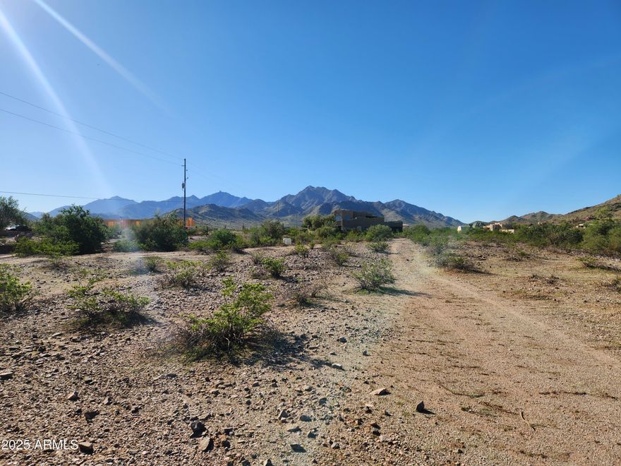 Great opportunity to own this 1.176-acre lot with spectacular views of the Estrella Mountains. This lot is located in a beautiful neighborhood surrounded by custom homes. There is no HOA, and water is provided by a shared water well.
