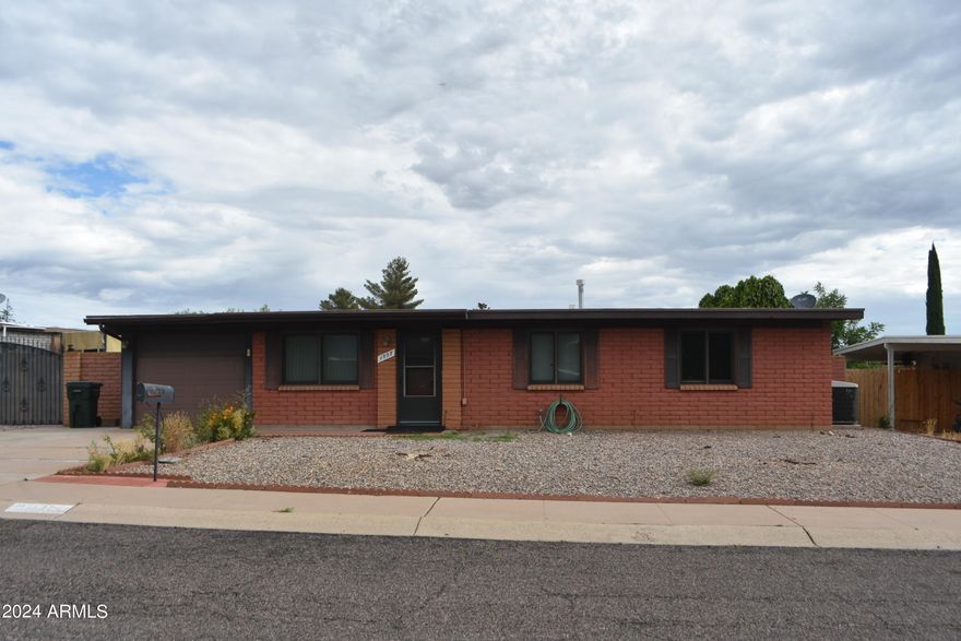 Great location close to shopping.  Nice three bedroom two bath with one car garage.  RV gate and parking. Custom Anderson windows, low maintenance for the spacious yard.  Includes washer and dryer.  Move in Ready.