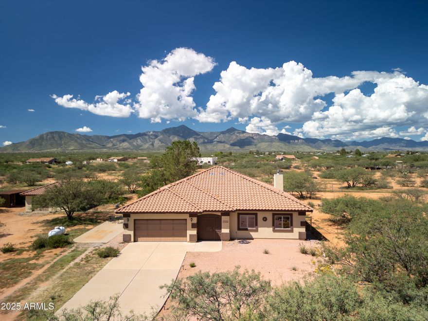 Beautiful Walston Home located on a mountain view lot.  This home boasts of pride of ownership.  Here is your chance to have a quality home with a separate workshop for all your hobbies.  Backyard faces the Huachuca Mountains for peaceful views.  Tile floors in the main areas. Kitchen is open to the main living room and dining area so you can stay connected. Don't miss this opportunity to have country living.