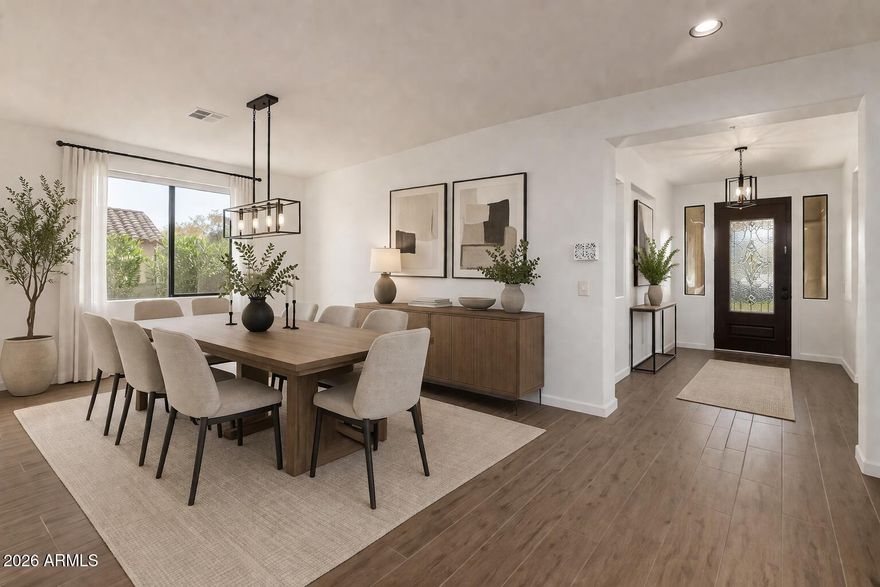 Seller willing to give a $15K concession towards rate buy down or kitchen renovation. Original owners! This beautifully remodeled luxury home sits on one of Verrado's most coveted lots--no behind neighbors and breathtaking mountain, city, wash, and neighborhood views from every angle. Perfectly positioned in Verrado, this residence offers unmatched privacy, scenery, and livability on an expansive 1/4-acre lot.Designed by Cachet Homes and upgraded throughout, this 4,893 sq ft home features 4 bedrooms, 3.5 bathrooms, and multiple flexible living spaces including two dens/offices, a teen room, formal dining and sitting rooms, and generous living areas complete with a fireplace. A full ensuite master bedroom is conveniently located on the main floor--ideal for multi-gen living or visitors. and butler's pantry with a beverage fridge. Authentic real wood floors, French doors opening to the backyard oasis with a pool, 
elevate the home's luxury feel. Fresh interior and exterior paint create a bright, turn-key atmosphere. Upstairs, the oversized primary suite showcases dramatic mountain views, a private sitting area, and a remodeled ensuite bathroom featuring a soaking tub and walk-in shower. Additional bedrooms are well-sized, and the upstairs laundry roomwith sinkadds convenience. A spacious loft offers yet another flexible living space. The home also includes a 3-car garage. The backyard is a true oasis boasting a pool, pavered patio, and lush landscapingan entertainer's dream with ample room for future enhancements such as a sports court or pickle ball. With no neighbors behind and sweeping views, the outdoor experience is exceptional.
Residents enjoy access to parks for walking, running, playing, and community gatherings. Verrado offers world-class amenities including multiple pools, the Verrado Golf Club with two championship courses, The Center on Main, over 80 neighborhood parks, and 21+ miles of hiking and biking trails. Located within the highly rated Litchfield Elementary and Agua Fria Union school districts, this home combines luxury, location, and lifestyle in one extraordinary property.