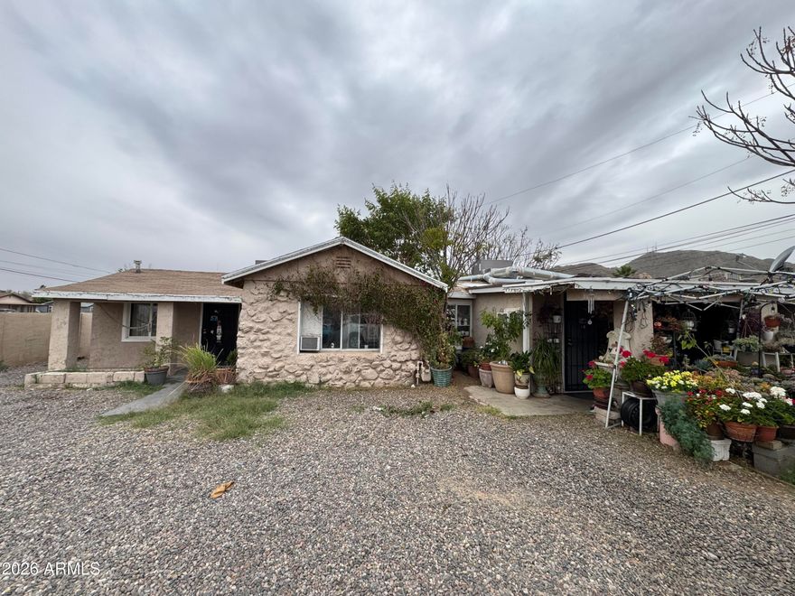 Unlock the potential of this versatile duplex, perfectly suited for investors, house hackers, or multi-generational living! Nestled on a generous 10,000+ sqft lot with mountain views & next to Mountain View Park, this property offers opportunity & convenience. Both units are currently occupied, generating a rent roll of $800 per unit. While the dwelling needs some TLC, it boasts spacious front and private backyards, ideal for outdoor fun or future upgrades. Each unit features a porch, a living/dining room, tile flooring, a kitchen with breakfast nook, two bedrooms, and a full bath. Close to schools, restaurants, shops, and the I-17, this location makes daily life a breeze. This is your chance to build equity, customize to your vision, and maximize value in a well-established area!