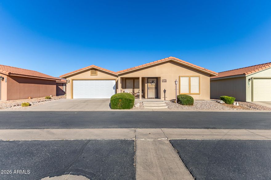 STUCCO HOME! Offering, High-& Energy-Savings. Surround yourself with beautiful desert living in this open-concept, split 2bd/2bth home that borders BLM LAND  offering the ''BEST VIEWS'' in the park of the Majestic, Superstition Mountains from a large, enclosed Arizona Room and or Master-Suite. Back yard is spacious and off the kitchen & master bedroom, covered patios. Upgrades include, new roof, LVT kitchen flooring and dishwasher, 2026, AC heat pump 2023 offers efficient electricity bills. Just off the kitchen, a covered patio for grilling as well as an enclosed Arizona room and 2-car garage.  Primary suite offers direct access to enclosed Arizona room as well as an outside covered patio offering seamless indoor/outdoor living. Master bathroom, 2 sinks shower and walk-in closet. Hall bath offers bathtub and shower, Built in office/custom living décor shelving as well as ample storage throughout. Dolce Vita, a sought-out 55+ community nestled close to the base of the Majestic, Superstition Mountains in Apache Junction, Arizona.This vibrant community offers a serene desert lifestyle with stunning mountain views where residents enjoy an active lifestyle with full range of amenities that include a 3,300 clubhouse that offers, state of the art gym, dance hall, card room, crafts room, pool hall, library, movie-room, zero-entry/walk-in pool, pickleball courts, mini putting green, shuffleboard, 3-dog parks, exercise classes and much more.