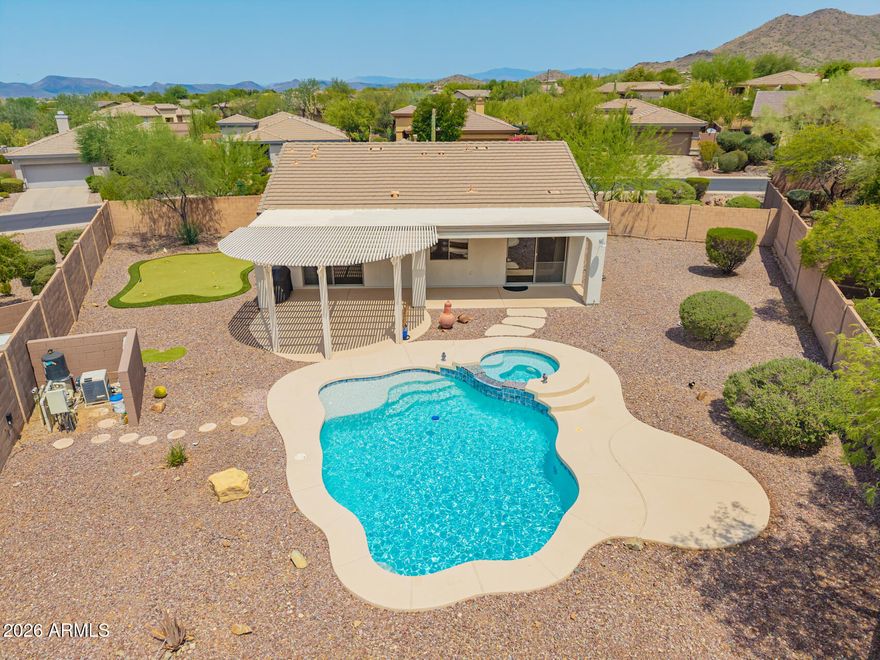 Fantastic, updated, 2 bedroom, 2 bath home with pool & spa in Anthem Country Club! Built-in Murphy bed in Bedroom 2. Huge backyard includes covered patio, putting green and heated pool/spa. Kitchen features raised panel cherry cabinetry, stainless appliances with gas range and granite counters. Remodeled primary bath features walk-in shower, dual closets & dual sinks.