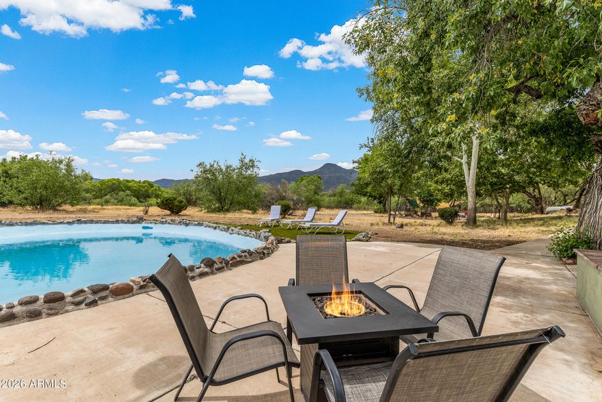 OASIS ON THE WATER! Experience this amazing retreat just steps from the river! This tranquil property offers the perfect getaway for peace and relaxation, allowing you to reset and escape as you soak up the sun surrounded by giant cottonwood trees and the subtle sounds of the running river. Nestled on over 6 acres of prime horse property, the estate includes a wading pool for the kids, a bunk house equipped with a kitchenette for guests, and endless miles of country to explore. This newly renovated home offers countless opportunities for fun, with newer updates including the roof, interior and exterior paint, HVAC system, water heater, appliances, and more.Whether you are looking for a primary home, a secondary retreat, or a lucrative VRBO investment, this property perfectly fits the bill!