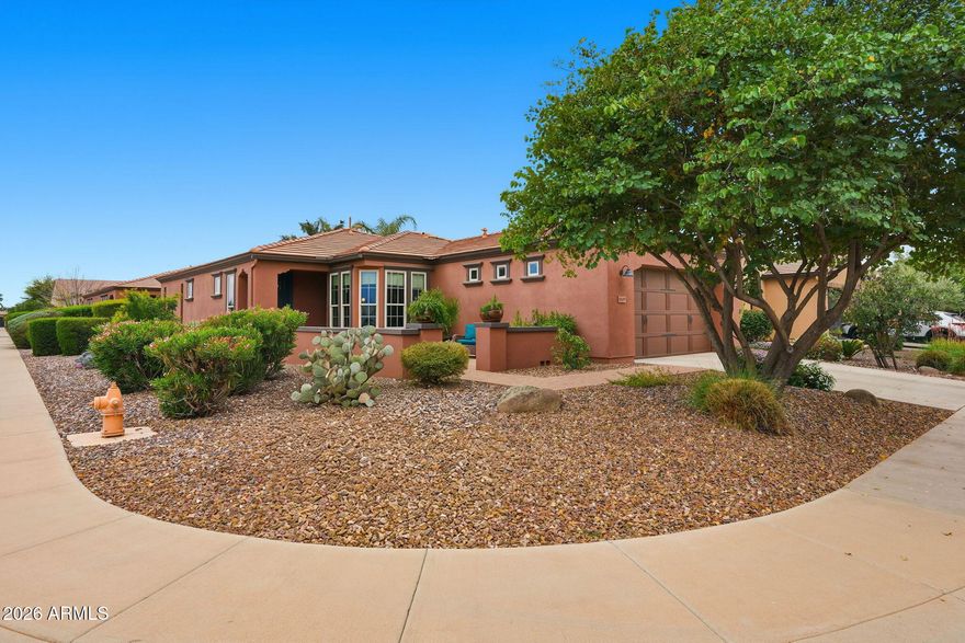 Beautiful corner-lot home in Encanterra Country Club featuring the highly desirable Monaco floor plan! The kitchen offers stone countertops, maple cabinetry, stainless steel appliances, a breakfast bar, and a charming eat-in area, plus a separate dining space for entertaining. Oversized patio sliders create seamless indoor-outdoor living and open to a covered patio with a cozy fireplace—perfect for relaxing or hosting guests. Rare opportunity to skip the golf waitlist: seller holds an existing golf membership allowing immediate golf privileges upon purchase of a membership. Enjoy the Encanterra lifestyle at its finest!  Enjoy the Good Life in Encanterra, with pools, Tennis, Pickleball, restaurants, work out facility and so much more!!!