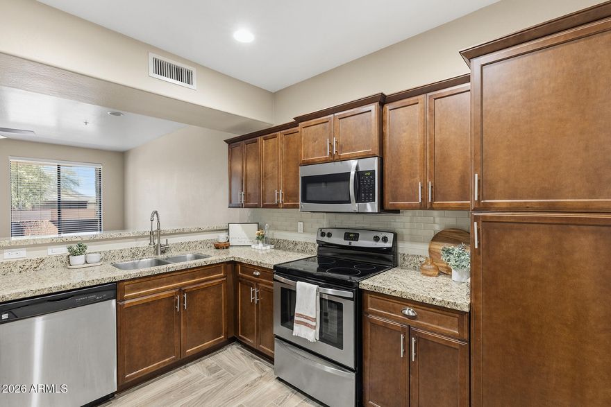 SPECIAL LENDER FINANCING AT 5.375%! // Seller offering a HUGE BUYER INCENTIVE- giving buyers immediate savings & added affordability! This beautifully maintained townhome is located in an exclusive gated community with breathtaking mountain views from the primary suite and balcony. Inside, you'll find granite countertops, updated cabinetry, & gorgeous wood-look tile flooring that brings warmth and elegance to the main living areas. All bedrooms and the laundry are conveniently located upstairs, and the second bedroom includes a walk-in closet.  A half bath downstairs makes entertaining easy. Unlike many townhome communities, this property includes its own driveway for added convenience. The HOA provides tremendous value by covering the roof, water bill, trash and more!!!