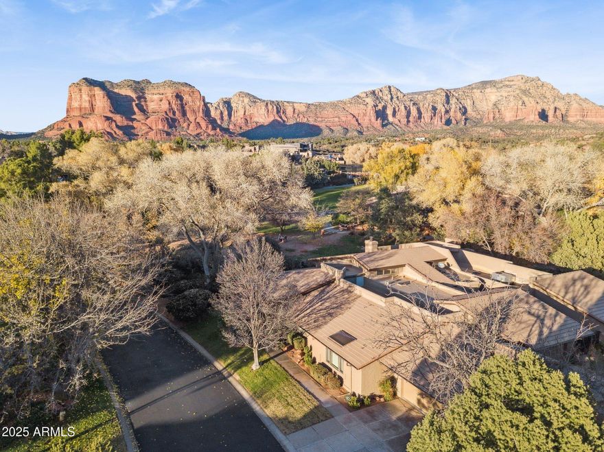 Experience the ultimate ''lock-and-leave'' lifestyle in this stunningly remodeled end-unit townhouse, perched within the prestigious, gated Canyon Mesa Country Club. Designed for those who value leisure over labor, this home offers a seamless blend of modern luxury and rugged natural beauty. Step out your door to a world-class 9-hole executive course. After a round, retreat to your spacious Trex deck to watch the sunset ignite the Red Rocks with a front-row seat to the fairway. Enjoy extra privacy, natural light from skylights, and the peace of being adjacent to a natural wash. Whether you're looking for a primary residence, a seasonal golf retreat, or a high-potential investment (no STR restrictions!), this move-in-ready gem is Sedona living at its most effortless. Living at Canyon Mesa Country Club means reclaiming your weekends. The comprehensive HOA fee ($676/mo) is designed for the traveler and the leisure-seeker, covering:
Total Exterior Care: Roof repair/replacement and exterior unit maintenance. 
Landscaping: Front yard and common area upkeep.
Utilities & Services: Sewer, garbage collection, and street maintenance. 
Security: Gated entry for peace of mind while you are away. 
Interior Excellence: Modern & Sophisticated
Originally built in 1985 but living like a 2024 custom build, this home was extensively remodeled to satisfy the modern palate:

The Chef's Kitchen: Outfitted with premium granite countertops, state-of-the-art stainless steel Whirlpool appliances, and custom cabinetry.
Floor-to-Ceiling Quality: New designer floor tiles flow throughout the main areas, complemented by fresh paint and updated fixtures.

The Master Retreat: Featuring a separate shower and jetted tub with a double vanity, creating a private sanctuary within the home.

Light & Airy: Vaulted ceilings and strategically placed skylights ensure the home is flooded with Sedona's famous natural light.

Outdoor Living & Red Rock Vistas
The "End Unit" status isn't just a label--it provides extra windows and a sense of isolation from neighbors. The crowning jewel is the expansive Trex deck. Unlike standard patios, this elevated space offers a panoramic vantage point of the lush golf course greens and the iconic Red Rock formations that define the Village of Oak Creek.

A Golfer's & Athlete's Sanctuary
Step out of your door and onto the executive course. Whether you are a scratch golfer or a beginner, the community offers:

Meticulously maintained greens and fairways.

Professional-grade Pickleball and Tennis courts.

A community pool and clubhouse for social gatherings.

Investment Flexibility
For the savvy buyer, this property represents a rare opportunity in Sedona. With no restrictions on Short-Term Rentals (STR), this home can serve as a lucrative vacation rental when you aren't using it yourself.