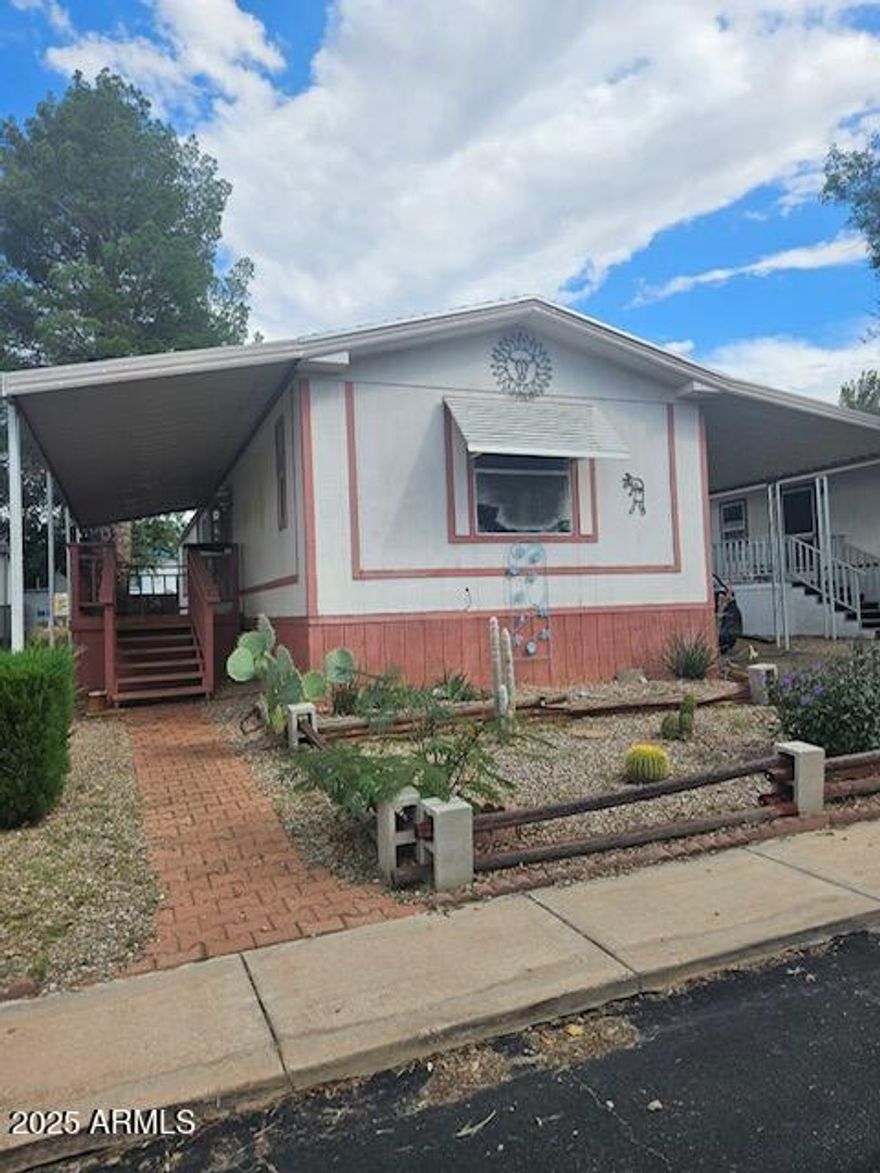 Good size, open living area. Three bedroom converted into a 2 bedroom. Buyer can easily convert back to 3 bedroom if desired. Covered carport at back entry of home, covered patio at front entry. Fenced back yard with storage shed. Home does need some work but it is priced accordingly. Home is in a gated community with 2 club houses, an outdoor and an indoor pool.