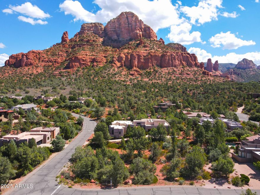 Build your dream home in the heart of Sedona's coveted Mystic Hills Subdivision! This gently rolling, .43-acre corner lot offers breathtaking red rock views and is ideally located between Uptown Sedona and the Village of Oak Creek, placing you moments from world-class hiking trails, shopping, dining, and endless outdoor adventure. Enjoy resort-style living with access to a vibrant community clubhouse featuring a pool, hot tub, fitness center, tennis, and pickleball courts. Mystic Hills is known for its socially active and welcoming atmosphere, making it one of Sedona's most desirable neighborhoods. This is more than just a homesite, it's a lifestyle in the Sedona sweet spot.