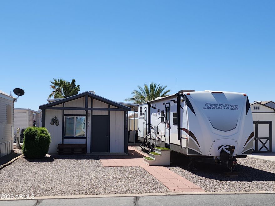 Great lot in the sought-after 55+ community -Tierra Del Sol RV park, in the safest small city in Arizona (2025) Florence AZ, where you own your own land so no lot rent. The purchase includes the lot that is 37' X 49' graveled lot with pavers for patio and walkways. Also included is a 2014 Keystone 36' Travel-Trailor that will convey to buyer at COE. The RV has an indoor kitchen as well as an outside kitchen when you move the party to the patio. Also included, a very nice 11' x 15' shed and new electrical additions, finished interior walls that have been insulated. All RV hook ups: electric post, water, and sewer are on the property. Tierra Del Sol has a large club house and a walled off pool with spa. A memorial garden for our servicemen and much more. The golf course is just up the street