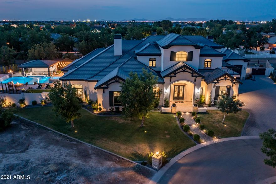 Your dream home awaits! With 8,100+ square feet of living space, this french chateau is nothing but a SHOWSTOPPER! 6 full bedrooms and 5 bathrooms.  Walk into this gorgeous home and notice the real hardwood floors with impressive entry way leading your eyes up the stairway to the massive ballroom chandelier on the ceiling. Very open and airy floor plan, you will find the stunning kitchen that is sure to be any entertainers dream, or private chefs! All the best of appliances, Electrolux built in oversized refrigerator, Thermador gas stove and not one but two dishwashers! not to mention a Separate butlers pantry off the kitchen! The most chic oversized laundry room you'll ever see! 4 bedrooms on the upper level connected by jack and jill bathrooms, full closets, and their own mini laundry ro