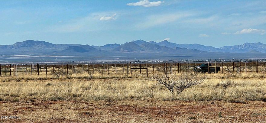 Views! Outstanding views from this parcel! This 4.93 acre property is level and cleared, many potential building sites. There is a 1,500 gallon septic tank and drain field installed. A potential building site is fenced and cross fenced. Property is zoned RU-4, site built or manufactured homes allowed. Utilize the Owner Builder Opt-Out and build your dream! Fema Zone X. Easily traversed dirt roads to the property. Buyer to verify all facts and figures.