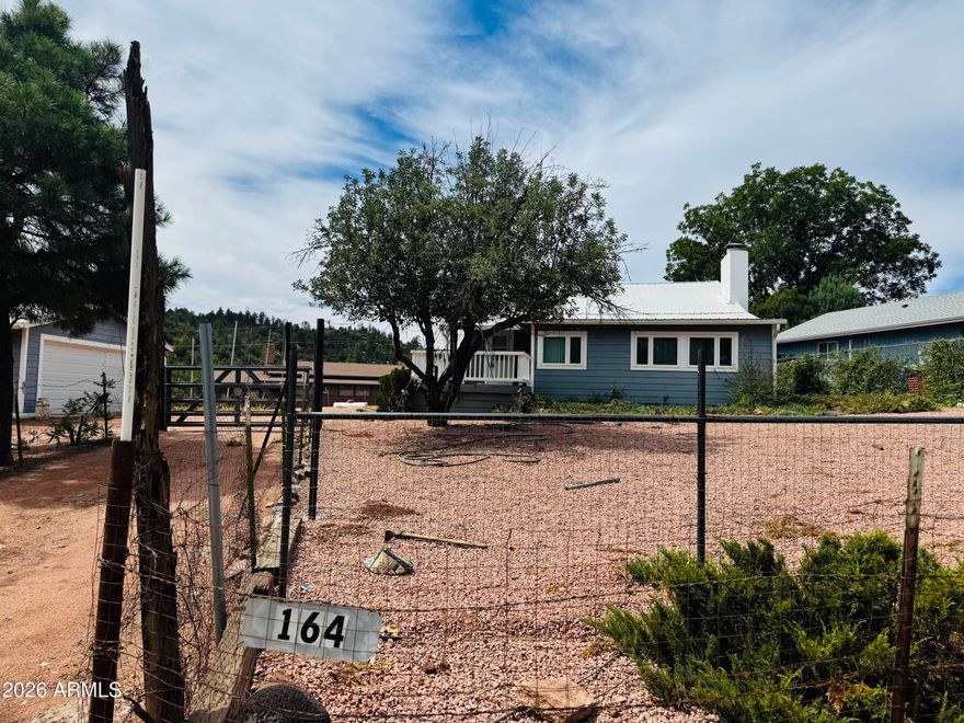 Looking for a cute getaway or VRBO?  This cute little home is it.  Enjoy the beautiful area of East Verde Park, walk down to the creek or swimming holes for a day of relaxation, take a hike, go for a ride, so much to offer in this great area.  This home offers a 1 bdrm/1 bath with a loft (great sleeping areas for the kids).  Home comes furnished and ready to move in.  Imagine sitting on the deck enjoying the cool air or cozy up by the brick fireplace inside.  Property is fenced and also offers a 2 car detached garage for all your toys plus a little workshop in the back.  Don't miss the great escape ,
