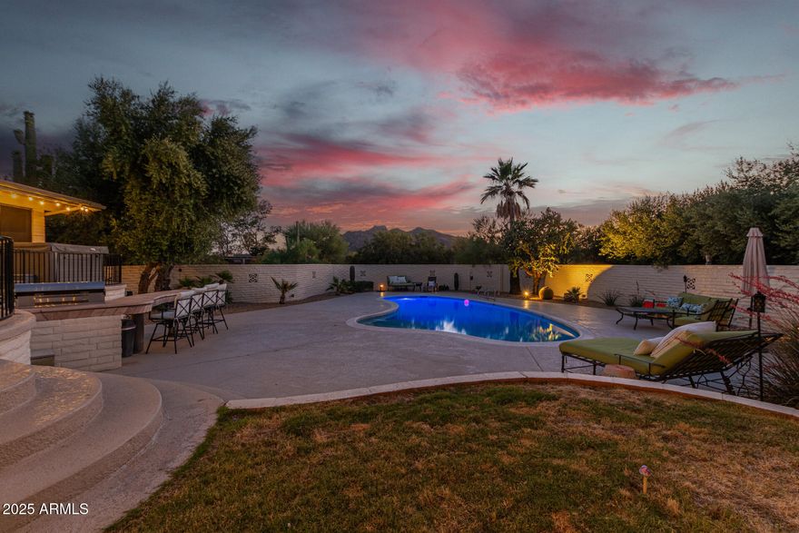 Welcome to a private desert retreat in beautiful Carefree, Arizona, set on a nearly 3/4-acre lot with mountain views and spectacular sunset skies, just minutes from the dining, golf, and shopping of North Scottsdale, Arizona and the charm of nearby Cave Creek, Arizona. 

Recently repainted and thoughtfully refreshed with a modern palette, this single-level home offers 3,052 square feet of comfortable living space, plus a relaxing Arizona room that adds additional indoor-outdoor enjoyment.

The backyard is the true highlight--an inviting oasis designed for the Arizona lifestyle featuring a sparkling pool, separate hot tub, expansive patios, and multiple seating areas perfect for entertaining or unwinding while watching the desert sky glow at sunset. Mature desert landscaping and privacy walls create a peaceful setting that feels secluded while still being close to everything.

Inside, bright living spaces flow comfortably for everyday living or hosting family and friends, with warm character, natural light, and excellent acoustics throughout. Major system improvements--including a newer roof, variable-speed HVAC system, updated electrical panel work, and new pool equipment--provide peace of mind and a solid foundation for the next owner.

With its private setting, spacious lot, and relaxed desert lifestyle, this property offers a rare opportunity to enjoy the beauty and tranquility of Carefree while remaining just minutes from the conveniences of North Scottsdale.

Arizona room adds additional useable space on top of the 3,052 square footage shown.