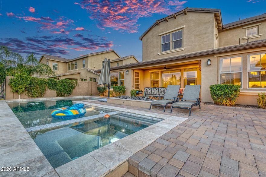 Experience resort-style living in the gated lake community of Echelon at Ocotillo. This beautifully upgraded 4-bedroom, 3.5-bath home with a dedicated office and spacious loft features a stunning great room floor plan filled with natural light. The chef's kitchen is designed to impress, showcasing quartz countertops, stainless steel appliances, gas cooking, an oversized island, walk-in pantry, and a stylish coffee bar. The downstairs primary suite is a true retreat, highlighted by a custom cedar wood ceiling and a spa-like bath complete with a soaking tub, expanded shower, and a custom walk-in closet. Upstairs, you'll find three additional bedrooms--including one ensuite--and a generous loft space perfect for a media room or additional living area. A standout feature is the optional, climate-controlled home gym--perfect for CrossFit and weight training enthusiasts--eliminating the need for a costly gym membership. The space includes a wall-secured rack, free weights, a universal Smith trainer with attachments, as well as a cardio stepper and bike, all enhanced with its own mini-split air conditioning system.

Step outside to an entertainer's dream backyard featuring a negative-edge pool, hot tub, travertine pavers, low-maintenance turf, and tranquil water views. Situated on a premium lakefront lot, enjoy peaceful surroundings with wildlife sightings and the soothing sounds of a nearby waterfall--creating a truly serene outdoor retreat.

Ideally located near top-rated schools, dining, shopping, and easy freeway access, this home offers the perfect blend of luxury and convenience.