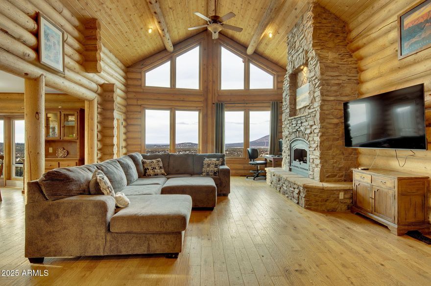 Luxury Mountain Retreat - Custom Log Cabin with Guest House & Horse Stable on 10 Acres!
Discover the ultimate mountain paradise with this stunning custom log home, perfectly set on 10 private acres with breathtaking panoramic views. Designed for comfort and elegance, this spacious retreat offers 5,142 sq ft of livable space, thoughtfully divided between the main home (4,372 sf) and a separate guest house (770 sf). 
The main home features a well-planned layout:
- Main Level: Open-concept living area with soaring ceilings, a cozy fireplace, and a luxurious master suite
- Upper Level: Three additional bedrooms, ideal for family or guests
- Lower Level: Includes two private suites, each designed for ultimate comfort and seclusion, perfect for guests or extended stays. -
For equestrian enthusiasts, the property includes a 4-horse stable with plenty of space for riding and outdoor activities. Enjoy unparalleled views from beautiful windows, wraparound decks, and outdoor spaces designed for relaxation and entertaining. This home seamlessly blends rustic charm with modern comforts, offering the perfect balance of warmth and contemporary convenience.

Nestled in a prime location, this cozy home offers the perfect base for exploring the best of Northern Arizona! Just 9 miles from family favorites like the Polar Express Train, North Pole Experience, and Canyon Coaster Adventure Park, you're never far from fun. Take a quick 9.5-mile trip into town to enjoy local shops, restaurants, and the thrilling Route 66 Zipline.
Looking for a day with animals or a bit of nature? Bearizona Wildlife Park is 9 miles away and The Grand Canyon Deer Farm is only 14 miles away, both offering a memorable experience for all ages. And for the ultimate adventure, the majestic Grand Canyon is just 50 miles from your doorstep, an easy and scenic drive to one of the world's natural wonders.