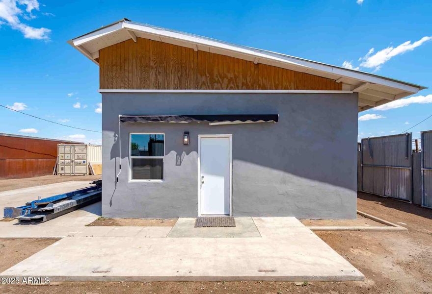 427 S 31st Ave is a fully renovated 708 SF industrial property sitting on a 10,400 SF lot zoned A-2 in Phoenix's industrial core. Upgraded in 2025, the building features high-end finishes, a brand-new roof, and flexible open space. Ideal for contractors, trades, or owner-users, this offering includes fenced yard access, two shipping containers, a 12,000 lb 4-post car lift, and a newly built kitchen and bathroom. With city utilities and additional stub-outs in place, it's ready for immediate occupancy.