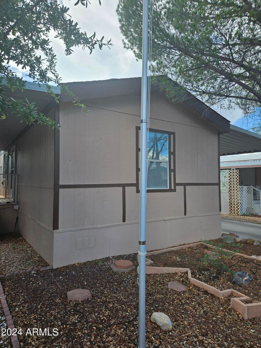 2 bedroom, 2 bath home offering 1,120 square feet of living space. Split bedroom plan. Front covered patio with wood deck. Wood fence around side yard of home offers a wonderful private area to enjoy being outside. Back yard offers a screened in patio area. Home also includes a shed on the property. Home is located in a gated community with two clubhouses. An indoor pool and spa are located at the larger club house and an outdoor pool is located at the smaller of the two club houses.