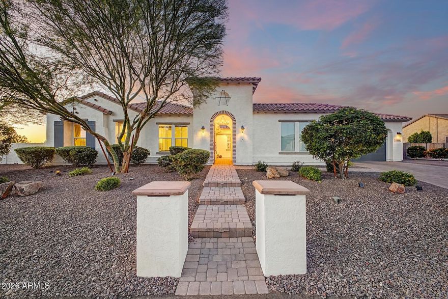 Better than new and loaded with high end upgrades, this stunning single level home offers 4 bedrooms, 3.5 baths and 3,300+ of open concept living, including a private ensuite and bonus teen room. Features include upgraded flooring and a gourmet kitchen with quartz, gas cooktop, wall ovens, large island, walk in pantry, and custom backsplash. The resort style backyard boasts a sparkling pool, turf, lush landscaping and a custom sport court with pickleball, basketball hoop and outdoor lighting. Curb appeal shines with a custom courtyard gate, front walkway & lighted columns. Includes dog run, & RV friendly community. Access to the 101, I-10, shopping, dining and entertainment. This is what buyers wait for - fully upgraded, move in ready and designed for the ultimate Arizona lifestyle.