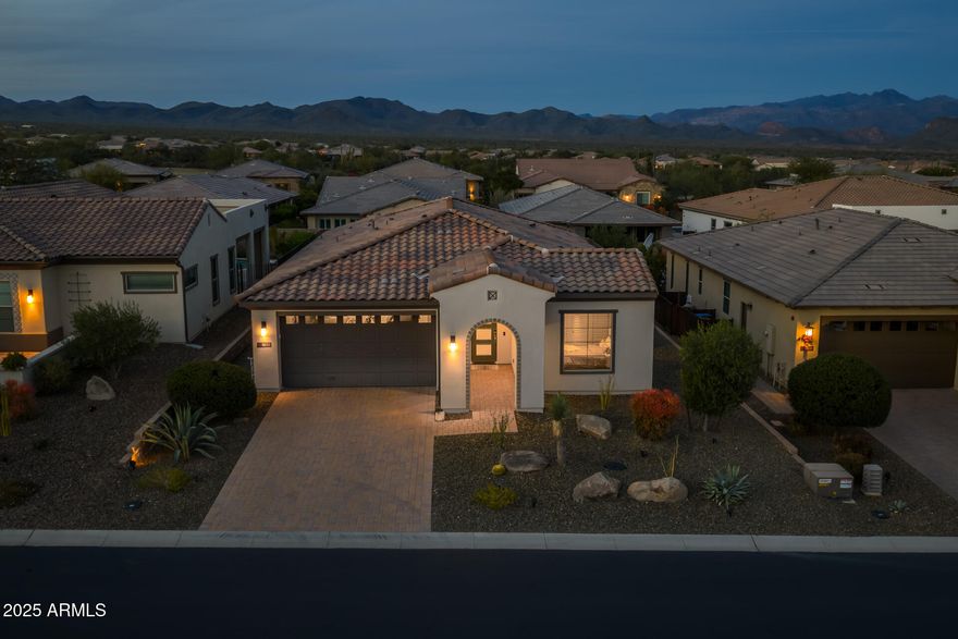 Welcome to this stunning Nice floorplan offering an open layout with 2 bedrooms and an office. Inside, enjoy neutral tones and quality upgrades including a reverse osmosis system and water softener. The chef's kitchen features upgraded Monogram built-in stainless steel appliances, a large island, and breakfast bar. The dining area showcases a multi-slide glass door with beautiful mountain views. Step outside to a resort-style backyard with a private pool, travertine deck, Sonoran landscaping, and a large covered patio with ceiling fan. Don't miss this incredible opportunity! 

The amenities at Verde River are World Class with Tom Lehman inspired eighteen-hole Golf course, tennis courts, pickleball courts, and bocce ball, heated lap pool and Resort style swimming pool, hot tub, community center has casual poolside dining at Eddy's Diner and gourmet dining at award-winning Needle Rock Kitchen and Tap, Alvea Spa with full-service Salon and Spa amenities, Art Loft and events center. Trilogy at Verde River is adjacent to the Tonto National Forest and is situated in the middle of miles and miles of hiking and biking trails.