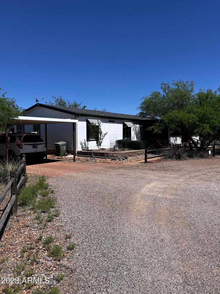 Breathe in the Fresh Air and listen to the sounds of Nature, while sitting on the great front porch...On this 1904 sq ft of living pleasure. 3 bed 2 bath, laundry room, extra Den/TV room. There is a full back porch with an outside kitchen. All this sits on 13.781 ac. complete with private well. Oh wait, there is more. A above ground pool. Oh wait, there is more. A 30'X40' (1,215 sq ft) RV garage complete with automatic roll up door. Two 4 ac parcels could be sold off if you were looking to do so. Horses, RV driving, build two more homes, there are endless possibles surrounding this property. The master has safe step walk-in tub. Living room has Quadra Fire pellet stove. Kitchen, Den, and back porch have flat screen TV stay. Home is equipped with tank-less hot water. New Roof see Doc Tab