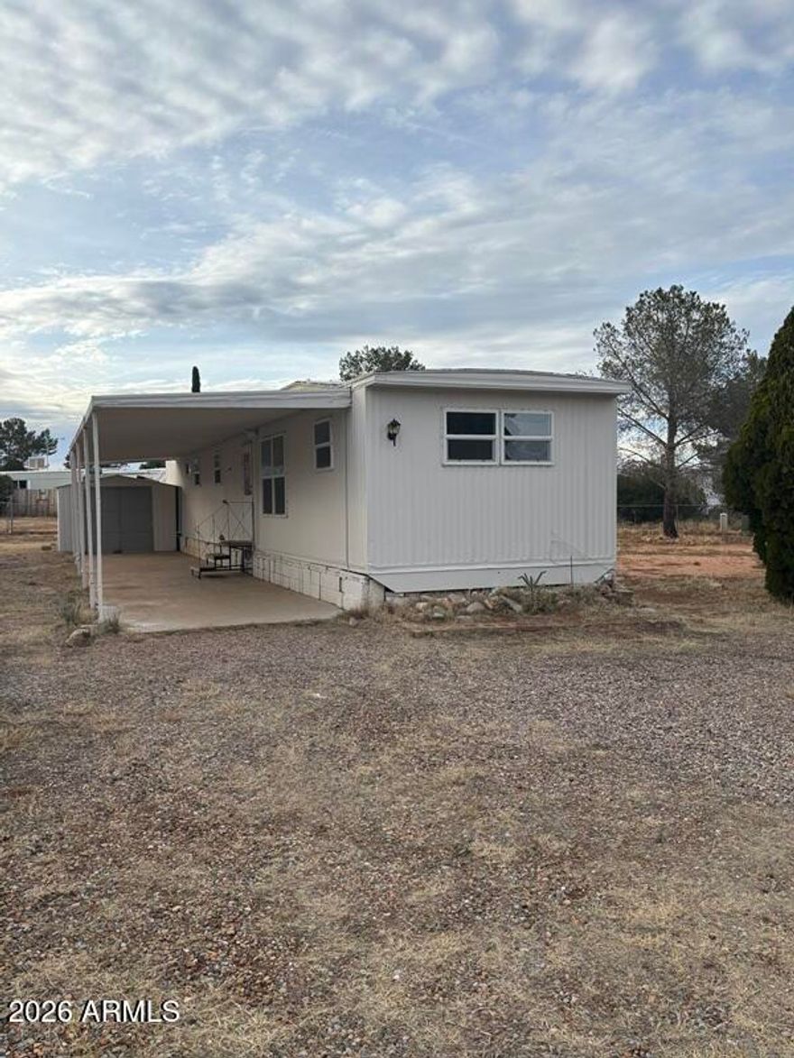 Bedroom 2 Bath single wide trailer in Golden Acres subdivision.  Nice open lot in a Cul-de-sac. Tool shed, new windows, carport, ceiling fans, evaporative cooler. The lot that the home is located is included in the transaction.  The HOA provides garbage service.  Home was recently painted, spare bath sink and washer hookups replaced