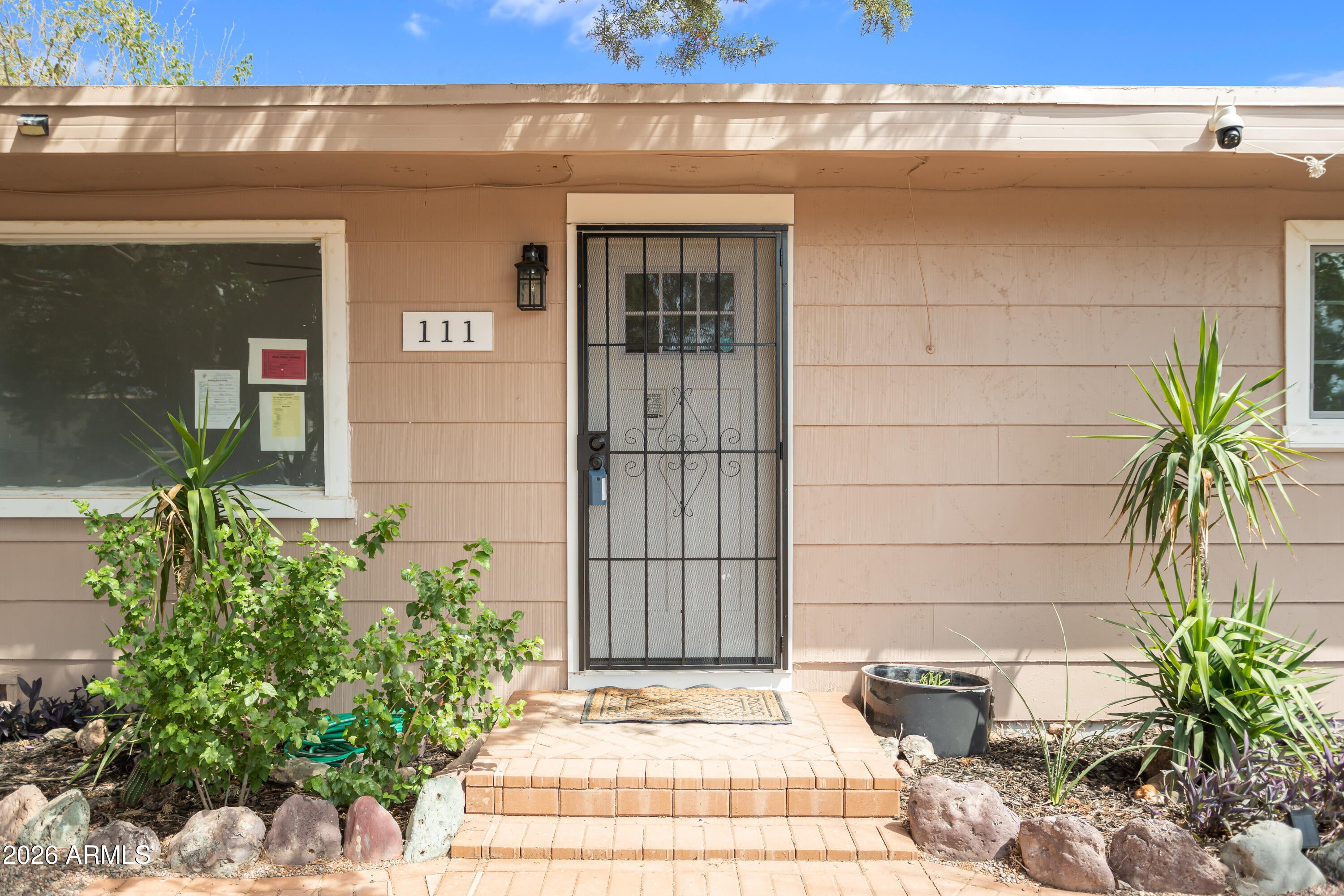 111 E APACHE Street