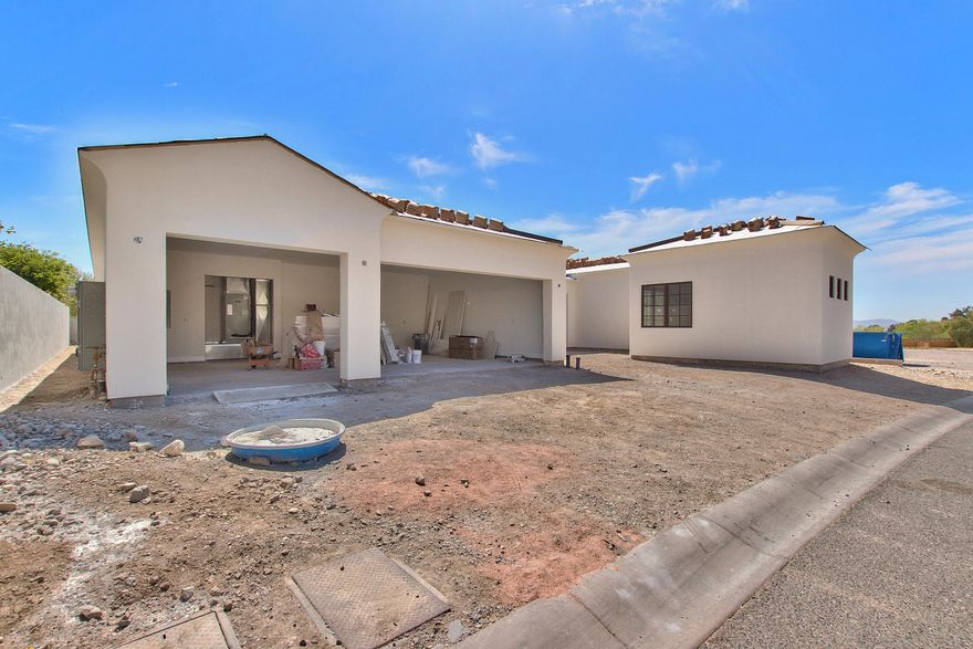 NEW BUILD ''LOCK AND LEAVE'' HOME BEHIND THE GUARD GATES OF THE VILLAGE AT PARADISE RESERVE! HOME IS APPROXIMATELY 60 DAYS FROM BEING COMPLETE. THE SANTA BARBARA ARCHITECTURAL STYLE WITH A HINT OF CONTEMPORARY IS A TIMELESS DESIGN. GUESTS WILL ENTER THROUGH THE GLASS AND IRON DOOR.THE FOYER, FORMAL DINING ROOM, GREAT ROOM WITH EXPANSIVE CEILING HEIGHT, EAT IN BREAKFAST NOOK AND CHEF'S KITCHEN ALL FLOW SEAMLESSLY FROM ONE ANOTHER. DU CHATEAU EUROPEAN WIDE PLANK OAK FLOOR ARE IN ALL THE MAIN LIVING AREAS, MASTER BEDROOM, AND HALLS. THIS HOME IS GREAT FOR ENTERTAINING. A RETRACTABLE WALL OF GLASS FLOW OUT TO THE LARGE COVERED PATIO AND FINISHED BACKYARD. THE CHEF'S KITCHEN WITH CUSTOM CABINETS, KOHLER FIXTURES, SUB ZERO APPLIANCES, LARGE ISLAND WITH EXTENDED BUILT IN TABLE FOR SEATING AND THE LATEST IN TIMELESS FINISHES WILL NOT DISAPPOINT. THE FIREPLACE WALL EXTENDS FLOOR TO CEILING AND LEADS YOUR EYE TO THE COFFERED CONTEMPORARY CEILING. THE BREAKFAST NOOK IS SO LARGE JUST OFF THE KITCHEN IT COULD BE USED AS AN INFORMAL SITTING AREA. THE SPLIT MASTER BEDROOM HAS A SLIDING GLASS DOOR LEADING TO THE BACKYARD AREA. THE MASTER BATH FINISHES ARE TOP NOTCH WITH SHOWER AND FREE-STANDING TUB. THIS HAS TO BE ONE OF THE LARGEST MASTER CLOSETS IN ANY LOCK AND LEAVE HOME, AGAIN NOT TO DISAPPOINT. TWO MORE GUEST EN SUITES, GUEST CASITA WITH AN ADDITIONAL BEDROOM AND BATH, POWDER BATH, PANTRY CLOSET AND LAUNDRY FINISH OUT THIS AMAZING HOME. THE VIEW OF THE MOUNTAIN PRESERVE AND SOME TWINKLING CITY LIGHTS ARE THE BACKDROP TO THIS PEACEFUL SETTING. THE 3-CAR GARAGE WITH EPOXY FLOORING IS LARGE ENOUGH TO FIT ALL SIZE VEHICLES AND ROOM FOR EXTRA STORAGE. THE FINISHES IN THIS HOME BLEND A LITTLE OF THE PAST WITH PRESENT AND MAKE THIS HOME TIMELESS.