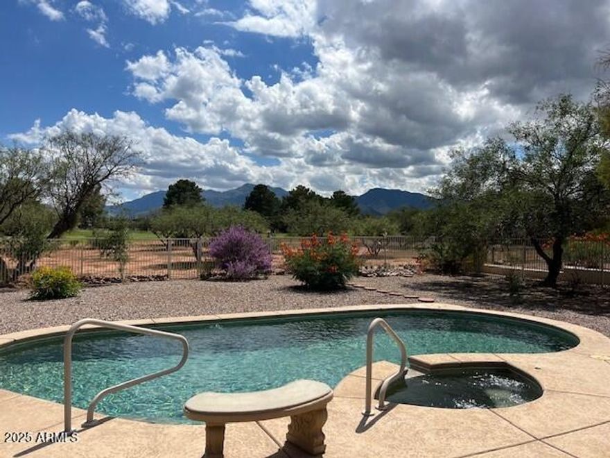 Beautiful 1,934 sq. ft. 3 bedroom, 2 bath, home located on the scenic #2 fairway with panoramic golf course, lake and mountain views. This property features a spacious great room design with a custom-tile surround, wood-burning fireplace, and seamless flow to the outdoor living space. The kitchen is a true highlight, offering stainless steel appliances, quartz countertops, a low bar island, large eat-in area, and extensive storage—ideal for the cooking enthusiast. From the kitchen sink, enjoy sweeping views of the backyard, solar-heated pool and spa, golf course, and lake. BRAND NEW pool filter and motor. Outdoor living is equally impressive with a full-length covered patio, firepit area, and garden space. The backyard overlooks meticulously maintained fairway grass you'll never need to mow, creating the perfect setting for relaxation or entertaining.

Additional features include a solar-heated pool and spa, abundant natural light, and thoughtful upgrades throughout. Set in a desirable Arizona location, this home combines comfort, convenience, and breathtaking views.