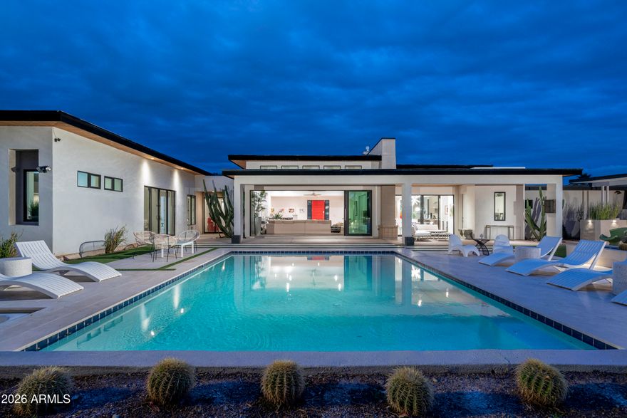 Resort Living in Magic Zip Code! This beautifully designed residence blends modern comfort, spacious living, and seamless indoor-outdoor lifestyle. The open, light-filled floor plan features expansive living spaces, soaring ceilings, and large windows. The chef's kitchen boasts a large island and premium appliances, flowing into the great room--perfect for entertaining. The primary suite offers a spa-inspired bath and generous walk-in closet, with four bedrooms for family, guests, or office space. Step outside to a resort-style backyard with pool, spa, covered patio, and multiple entertaining areas. Minutes from Kierland Commons, Scottsdale Quarter, dining, and golf, this home delivers the ultimate Scottsdale lifestyle.