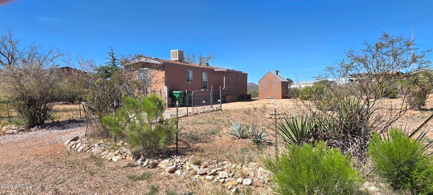 Two bedroom, one bathroom home in a quiet residential neighborhood. The yard is fenced and there is an outbuilding for storage. There is a 5.75 X 23 foot unheated bonus room. Just minutes from the heart of Tombstone.