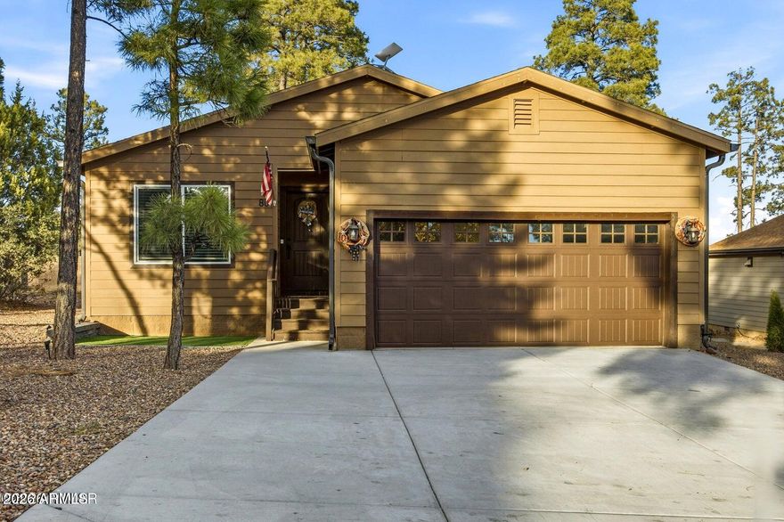 Located in the beautiful gated community of The Village in Show Low, this fully furnished single level 3 bedroom, 2 bath home offers comfort, charm, and convenience. Designed for easy living, it features a 2 car garage, nicely landscaped yard, and a functional layout all on one level. Enjoy year round comfort with forced air gas heating, central AC, and a gas water heater, along with smart home technology for modern, connected living. Step outside to a stunning covered back deck with peaceful views of the tall pine trees, plus a beautifully pavered area that creates the ideal hangout spot for relaxing evenings, entertaining friends, or gathering under the mountain sky. This home blends mountain charm with everyday comfort in a highly desirable gated setting.