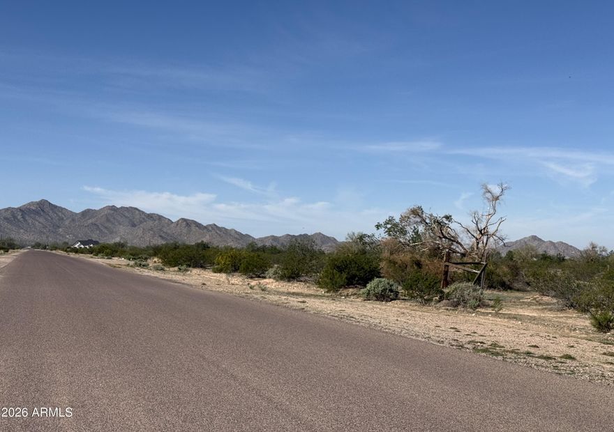 This 18.8-acre parcel offers a unique opportunity for those seeking a serene escape with stunning mountain views.  Situated southeast of Century Rd & Ralston Rd, this prime location is approximately 20 minutes south of the Maricopa city center and 3 miles north of I-8, offering excellent accessibility and promising future development potential. Surrounded by residential and horse properties this acreage presents a convenient yet peaceful setting.  This is a golden opportunity for investors or those looking to build their dream home in a picturesque setting with paved access close enough to amenities yet further away from it all. Use all 18.8 acres or split the property into multiple lots.  This listing is for parcels 501-10-036 and 501-10-037.