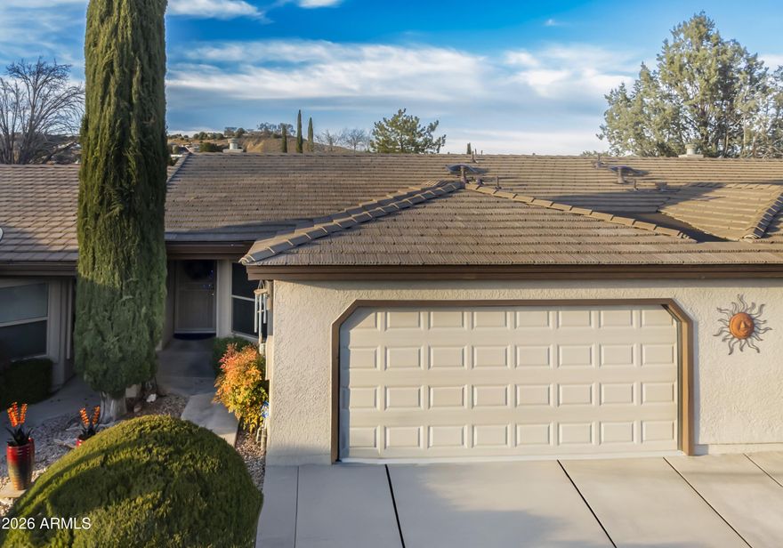 Golf community in Cool Prescott...90 miles from Phoenix with easy access to I17 and Hwy's 69 and 89. Move in ready, fully remolded 1198 sq ft 2 bedroom and 2 bath townhome located in the highly desirable Prescott Golf Club. Prescott Golf Club townhomes are a fully turnkey community covering all your exterior needs through the HOA. Imagine never worrying about the costs of your roof, landscaping, exterior painting and maintenance, garage door, or concrete driveway and sidewalk if in need of repair. This all-inclusive HOA covers all of this for you along with your waste water system. This townhome is a bright open concept unit featuring vaulted ceilings, 4 skylights, vinyl plank flooring, floor to ceiling stone look fireplace with wood mantel and lifetime warranty triple pane windows... Step outside to a covered patio perfect for relaxing and enjoying the outdoors. The beautifully updated kitchen with newer cabinetry, granite countertops, and stainless-steel appliances will surely impress. Newer cabinets with granite tops and vessel sinks were added to both bathrooms, along with all light fixtures and switches, fans, and outlets throughout the home. This truly is a turnkey property so come view it today!