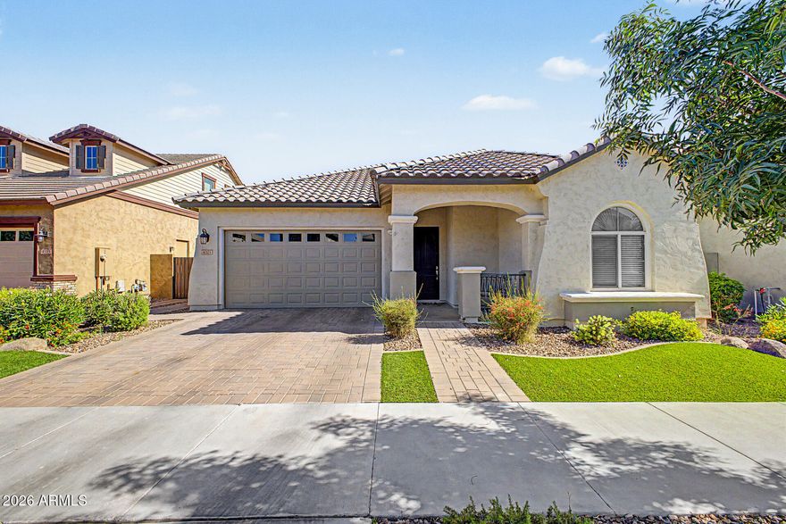 Welcome to this beautifully upgraded 3-bedroom + den home that perfectly blends comfort and style. From the moment you arrive, you'll notice the attractive curb appeal featuring paver driveway and walkways, manicured landscaping, turf accents, and charming covered entry architecture. Home shows like a model.

Inside, this thoughtfully designed   home showcases wood plank/tile flooring, soaring 10-foot doors, surround sound with 5 speakers and subwoofer, prewired security, and WiFi-enabled programmable features. The open-concept living space flows seamlessly into the gourmet kitchen complete with granite countertops, gas cooktop, designer hood, glass pantry door, and prewiring for additional kitchen lighting. Stove can covert to electric.  The laundry room features cabinets, a counter