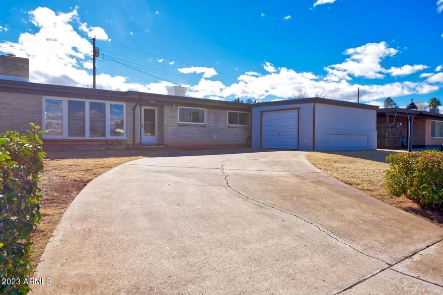 THIS is a well maintained home!  This 3 bedroom 2 bath home really shows pride of ownership  This well established centrally located property close to shopping and Elementary School, could be yours!  It's move in ready and waiting for it's next family.  Most of the big stuff has been done for you  Newer flooring, hickory kitchen cabinets, recently painted exterior and interior paint, and new rolled roof.  Single car garage was originally a single carport, and was converted to a garage with plenty of storage space.  This home has been greatly cared for over the years, and will make a wonderful home for some lucky family.  Call today to see!