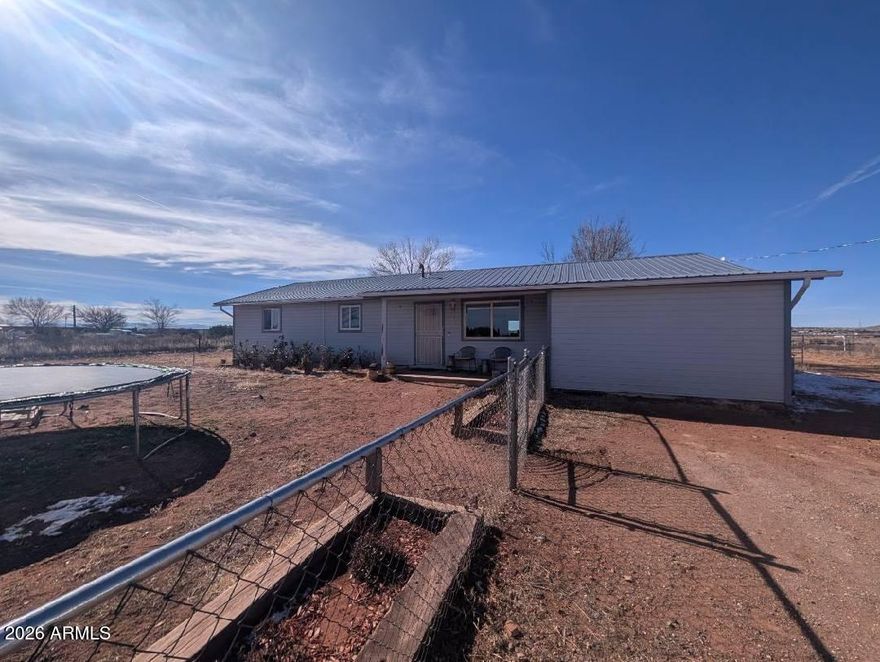 If you are looking for a horse property and a true country lifestyle but only 3 minutes from the center of town, look no further! This 1 acre property hosts a 3 bed 1 bath family home, a 6 stall barn with tack room, hay storage and pipe corrals with horse shelters.  The front and back yards are fully fenced; plenty of space for a garden with raised beds and even includes a small greenhouse!  Large Chicken Coop is negotiable! Don't miss out on this beautiful home in this  quiet neighborhood!  A must see!