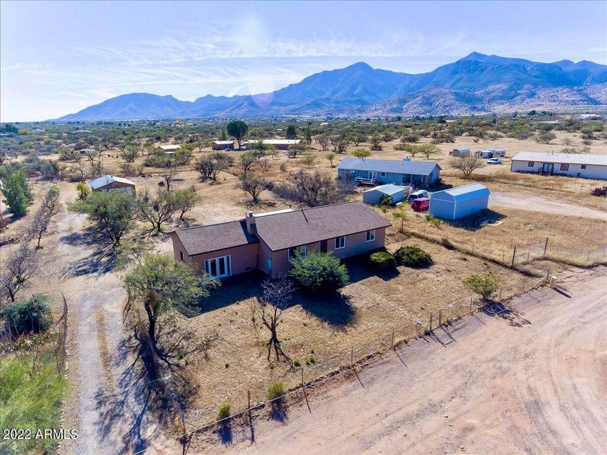 Do you need space inside and out?!! This ranch style, site built home is for you! Highly updated home with 3 bedrooms, 3 bathrooms, 2 spacious living areas and 2 car detached garage with workshop area!!  No carpet, ALL tile, fully redone kitchen with upgraded cabinets that feature pull out shelves, new appliances, and stunning countertops. The first living area features a wood fireplace & recessed lighting. The second living area has an en suite bathroom, exterior access and could be utilized in numerous ways: game room, in law-suite, guest area (easy conversion with existing murphy bed) etc. One acre parcel with incredible mountain views!!  RV hook up and RV parking available! All nestled at the end of a quiet road, no HOA, pride of ownership home! ***Do not use GPS, that way is rough, please follow directions!!!*** South Hwy 92, East on Hereford Road, West on Janice Dr (Edward V Dr.), East on Calle de la Fresca, North on Calle de la Cereza, East on Calle de la Manzana, North on Calle de la Menta, East on Calle del Narcisco, North on Calle de la Rosa, East on Calle de la Palmera, property on Right.