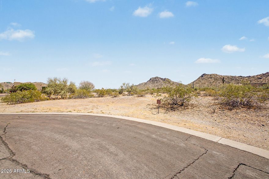 Rare opportunity to own 1-acre property on a coveted cul-de-sac corner lot in The Summit with 360-DEGREE BREATHTAKING MOUNTAIN VIEWS!! Build your perfect sanctuary surrounded by serene scenery and bring your dream home to life! Use existing builder plans or design your own! Discover everything Estrella master planned community has to offer including Troon golf course, two lakes, two club houses with gyms and pools (even a heated lap pool!), walking paths, hiking and biking trails, pickleball courts, and so much more!