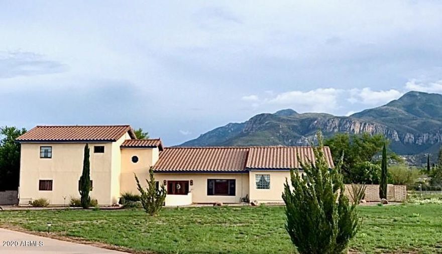 Spacious Split 2,804 sq ft, 4Bd/2.5Ba home with Majestic Mountain Views! LARGE Master Suite downstairs w/walk-in closet, double sinks, garden tub/separate shower, exposed beam ceilings and french doors leading out to the patio/pool area. Three bedrooms and a full bath upstairs. The HUGE kitchen boasts granite counter tops, an island cabinet with breakfast bar & nook and LOTS of cabinet space! Walk out of the over-sized family room through the double french doors to enjoy the mountain view or relax in the sparkling pool and spa. Don't forget the Saltillo tile, central vacuum system, wood ceilings & much, much more! Must see to appreciate all this home has to offer!