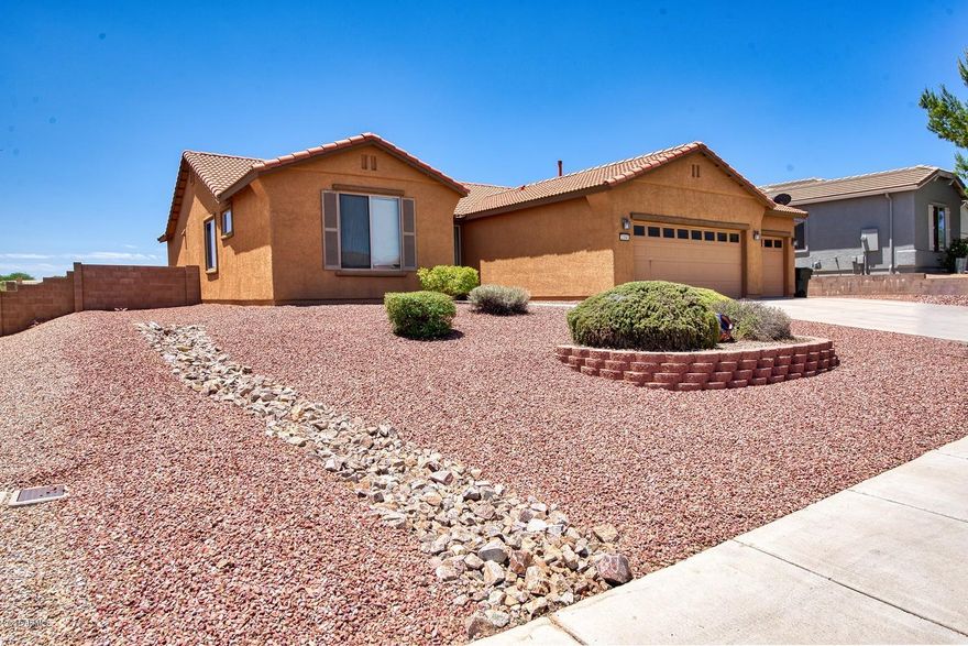 Come check out these mountain views and the large, open feel of the backyard!  Stunning view over the golf course, easy access to paved trails, view panels in the block wall.  3 bedroom home with an office or den (easily a 4th bedroom), 2 bathroom, 3 car garage home with huge open concept living area!  This one is ready to become yours.  No HOA, amazing views & location, move in ready!