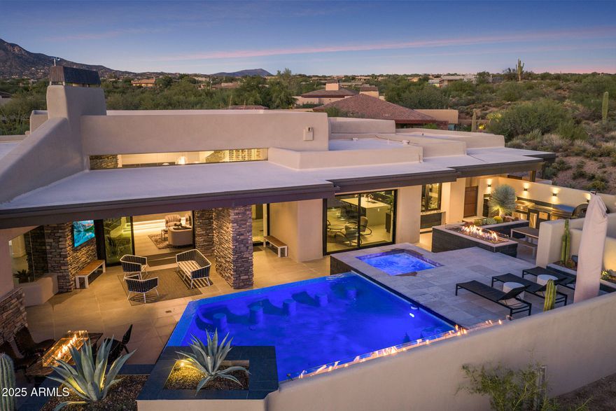The epitome of modern luxury living in the exclusive, guard-gated golf community of Desert Mountain in Scottsdale. This is more than a home it's a lifestyle. Experience true elegance in this extensively reimagined and luxuriously remodeled home Designed with the vision of JSF Design with the impressive upgrades and enhancements completed by the current owner. The home has been thoughtfully refined inside and out, combining luxury finishes, smart technology, and high-end lifestyle features that make it truly exceptional. This home showcases exceptional attention to detail, combining timeless finishes with modern functionality. Situated on a secluded cul-de-sac lot with total privacy, the home seamlessly blends hotel-chic sophistication with effortless indoor/outdoor living. Soaring 10-foot walls of glass invite natural light and frame stunning desert views. Designer-selected finishes include dramatic stone slabs, sculptural lighting, and custom cabinetry that elevate every space.

The open concept design creates endless opportunities for entertaining. Inside, enjoy expansive living areas, a modern temperature-controlled wine display, and a private theater room perfect for movie nights. Each of the three bedrooms features its own ensuite bath, offering comfort and privacy for family or guests.

Step outside to your own resort-style retreat, complete with a heated pool and spa, lavish outdoor kitchen with pizza oven, fire and water features, and beautifully curated desert landscapingideal for gatherings both large and intimate.

Desert Mountain offers a lifestyle unlike any other, with access to the world-renowned Desert Mountain Golf Club, fine dining, hiking, biking, and an array of outdoor activities. Golf Membership not included; membership details available upon request.

This turnkey property combines striking beauty with thoughtful functionality, offering the space you desire and the modern new-home feel you've been searching for. Come in, get comfortable, and enjoy your private luxury escape.

A detailed summary of the impressive upgrades and enhancements completed by the current owner is available upon request.