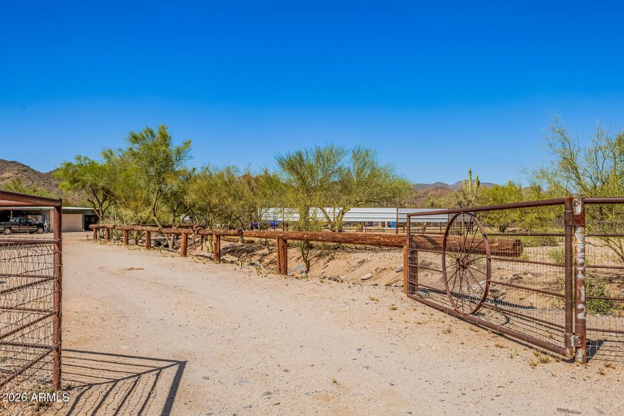 Location! Exceptional horse property designed w/ both horse & rider in mind! This well-equipped equestrian property features (3) spacious 12' x 20' horse stalls, (2) turnouts, (2) large pens, & addt'l large long pen, providing ample room for training & turnout. 3-ton horse pellet silo. (5) 16' x 16 Galvanized 4-rail guest horse pens. Equestrian amenities include 12' x 12' tack & feed room, 53' portable round pen w/metal sighting, 46' x 16' enclosed barn w/attached 10' x 40' tool shed. Horse hitches conveniently located throughout property for easy saddling & handling. Ideal for horse owners w/trailers & equipment! Property has (3) RV/trailer hookups, buried 275-gallon septic tank for RV servicing, & additional trailer parking w/a 30' x 50' covered area featuring 100-amp power capability.