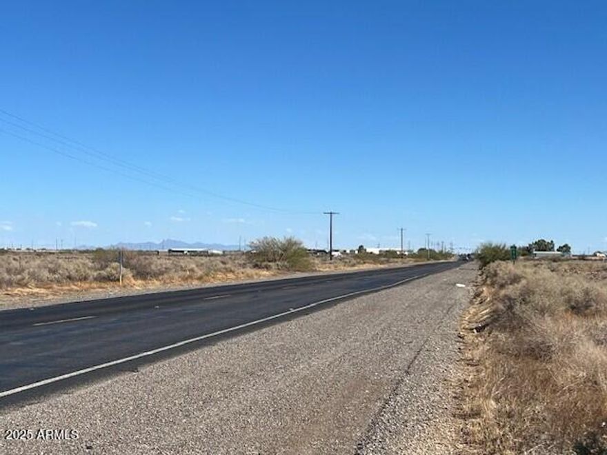 Fantastic investment opportunity with paved road access. Beautiful panoramic view. Very few neighbors. Great location for a custom or manufactured home. Located near I-10 and the masterplan community Belmont. No HOA and plenty of room for Horses, Toys & RV parking. Additional Maricopa County parcel # 506-44-108K. Property tax are for both parcels.