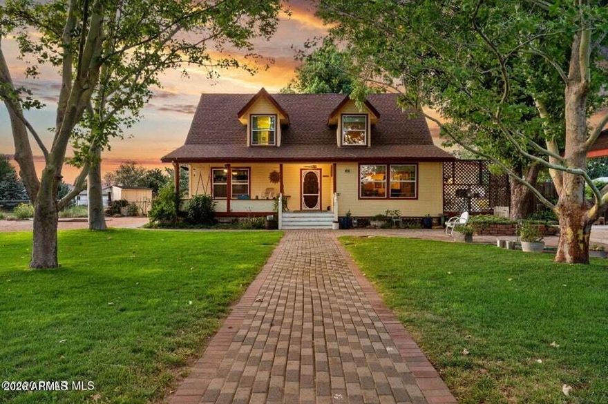 Charming Chino Valley Home on 1.25 Acres. Discover this beautifully crafted country-style home, thoughtfully built and lovingly maintained from the ground up. This inviting property includes a 1914 sq ft main home, a 704+ sq ft guest house, multiple outbuildings, and park-like outdoor spaces. A private well serves the gardens, landscape and barn, City Water serves the homes. The Home features 3 Bedrooms, 2 Baths and Main Level living. Warm and bright Kitchen , Living Room, and Dining Room. Stunning Red Oak flooring throughout the main living area and Custom Oak door trim, handmade by the seller. The Dining Room is wrapped in T&G Colorado Aspen on both the walls and ceiling. The comfortable primary bedroom suite and a truly artistic bathroom showcase an antique clawfoot tub and custom tiled walk-in shower. Upstairs you'll find two additional bedrooms, a full bath, and a practical office/hobby room. Enjoy the outdoors from multiple gathering spaces, including: " Welcoming covered front porch " Relaxing covered back porch " Deck off the Dining Room " Back patio with firepit--perfect for roasting marshmallows The large fenced yard features mature trees and lush landscaping, creating a serene retreat for family and friends. The detached guest house offers excellent versatility with an open studio-style layout, kitchen, and 3/4 bath, plus a 1-car garage. The loft above is insulated, wired, and ready for your finishing touches. Outbuildings - " Classic Lantern Barn with fenced turnout--ideal for a horse. " Upscale chicken coop with hen house, lay boxes, and dedicated chick-raising space. " Detached 2-car garage/shop--perfect for mechanics, woodworkers, or hobbyists. " The most charming doghouse you've ever seen. This is more than a property--it's a legacy waiting for its next chapter.