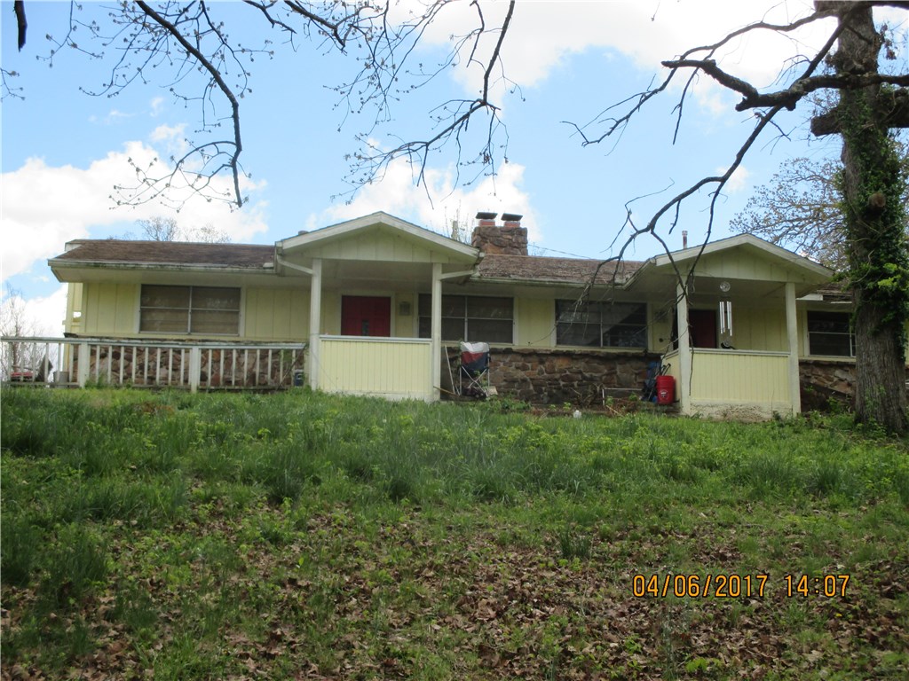 Property being sold "as is". 2 bedroom 2 bath duplex close to Beaver Lake. Each side has gas log fireplace in living room open to kitchen. Master bedroom has Jacuzzi tub and separate shower. With TLC this would be a great investment property.