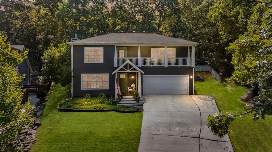 Nestled on a quiet cul-de-sac, this home captures the nostalgic charm of all-American living in a wonderful community. Beautiful stone and wood details frame a 2-car garage with a patio over looking you're private setting. Inside, you’ll find 5 bedrooms, including two that can serve as primary suites, and 3.5 baths. The updated kitchen with its open layout flows seamlessly into a cozy sunken living room, creating an inviting space for everyday living, while the backyard patio is perfect for entertaining or relaxing with your favorite book. Just 1 mile from top Fayetteville schools and a quick bike ride to Niokaska Creek Trail, this home offers both comfort and convenience