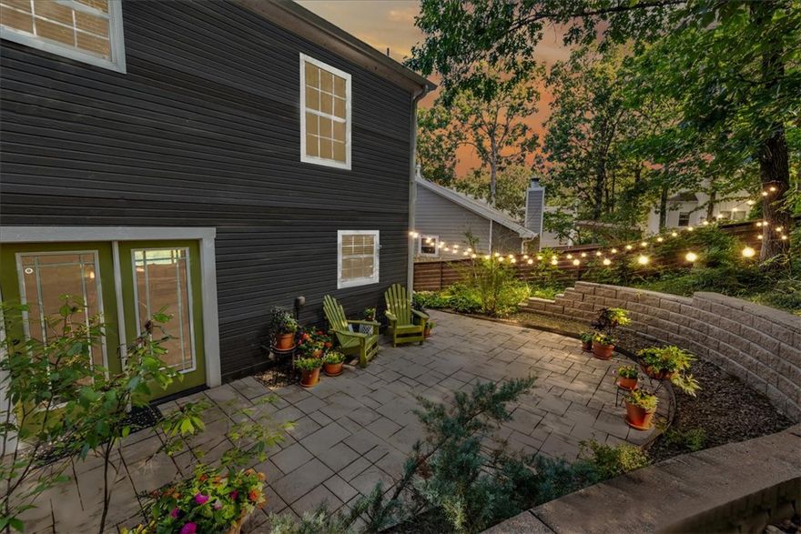 Nestled on a quiet cul-de-sac, this home captures the nostalgic charm of all-American living in a wonderful community. Beautiful stone and wood details frame a 2-car garage with a patio over looking you're private setting. Inside, you’ll find 5 bedrooms, including two that can serve as primary suites, and 3.5 baths. The updated kitchen with its open layout flows seamlessly into a cozy sunken living room, creating an inviting space for everyday living, while the backyard patio is perfect for entertaining or relaxing with your favorite book. Just 1 mile from top Fayetteville schools and a quick bike ride to Niokaska Creek Trail, this home offers both comfort and convenience