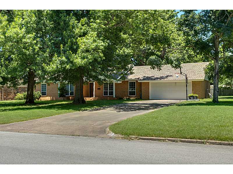Beautiful, all-brick, 4/2.5 updated family home in heart of Springdale. NEW: HVAC '12, windows '14, & water heater '15. Mature trees, 2 dens, fenced yard, clean, and move-in ready. Frig & stove convey. Great location - close to everything. Many updates.